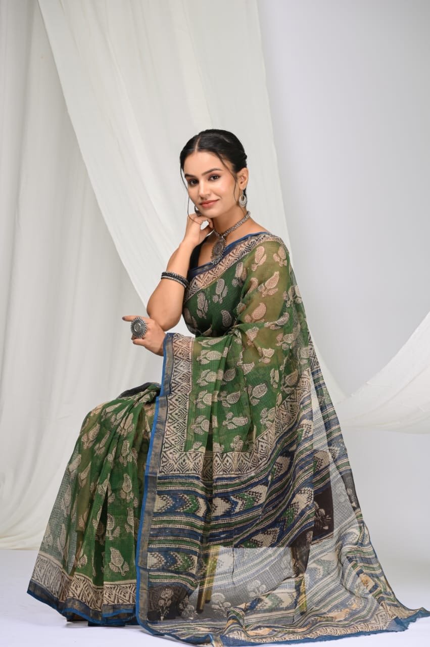 Green saree with floral motifs and geometric border design