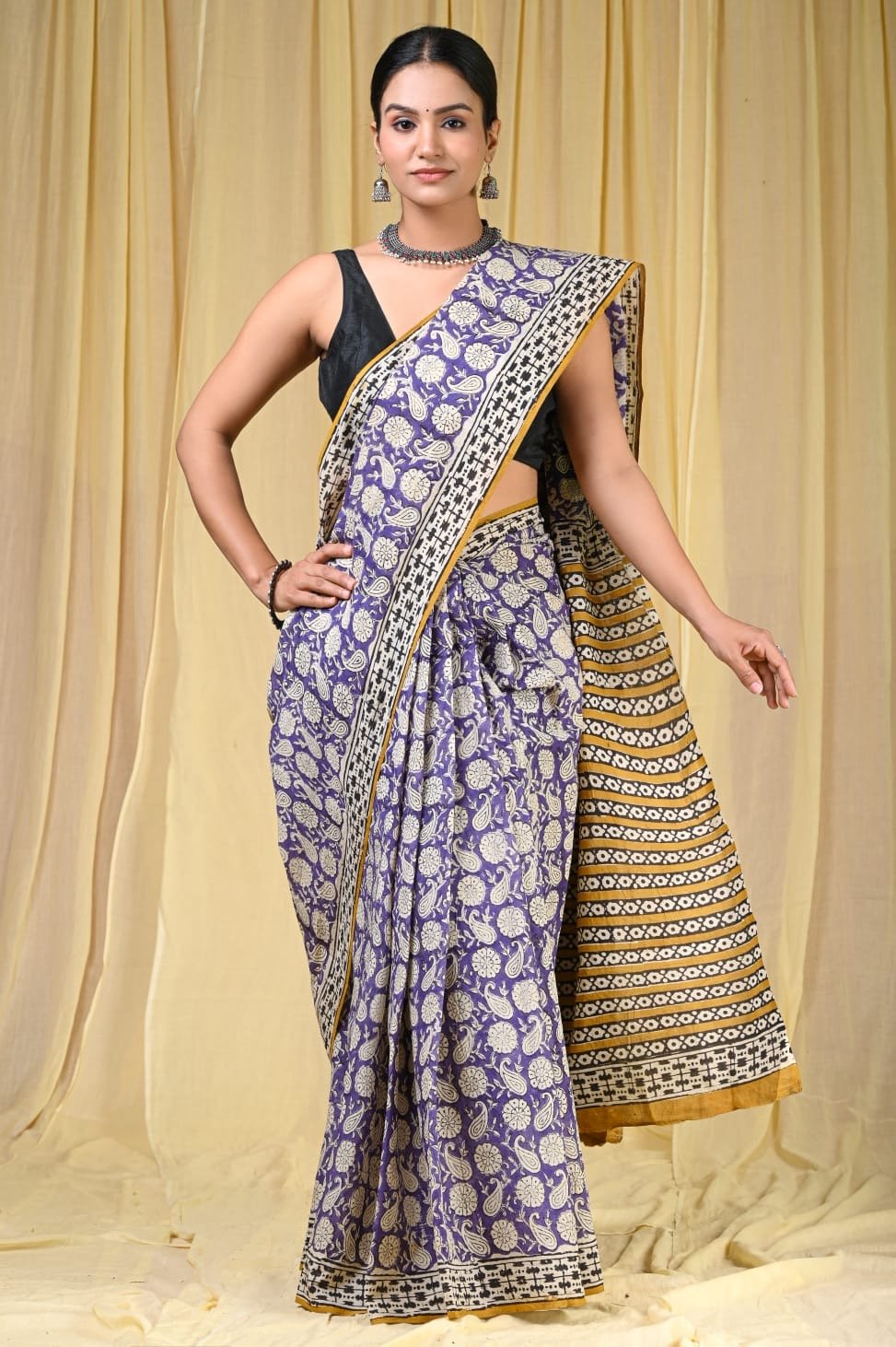 Purple Mul Cotton saree with floral motifs and striped pallu