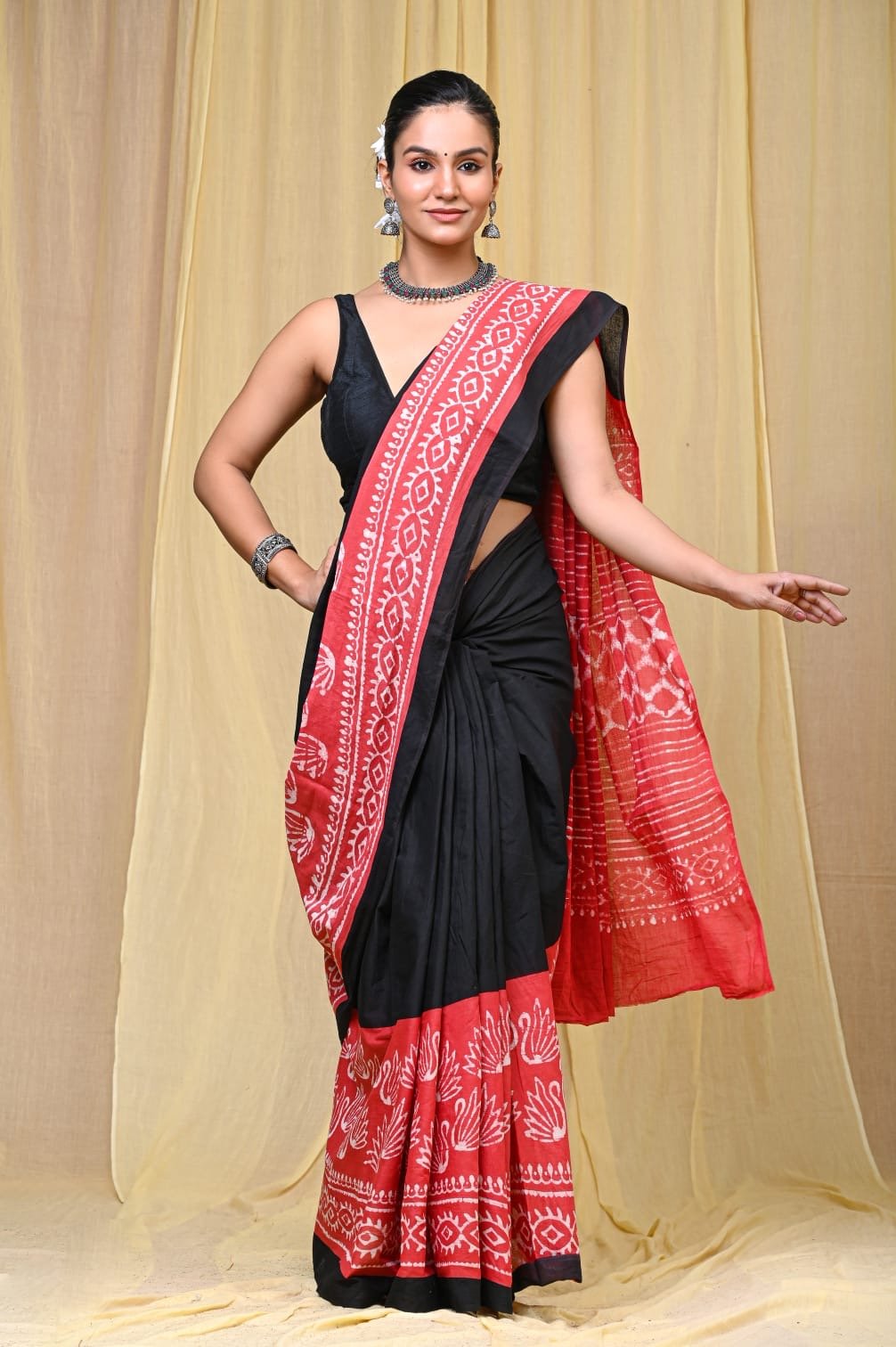 Black and red saree with geometric and floral block print motifs