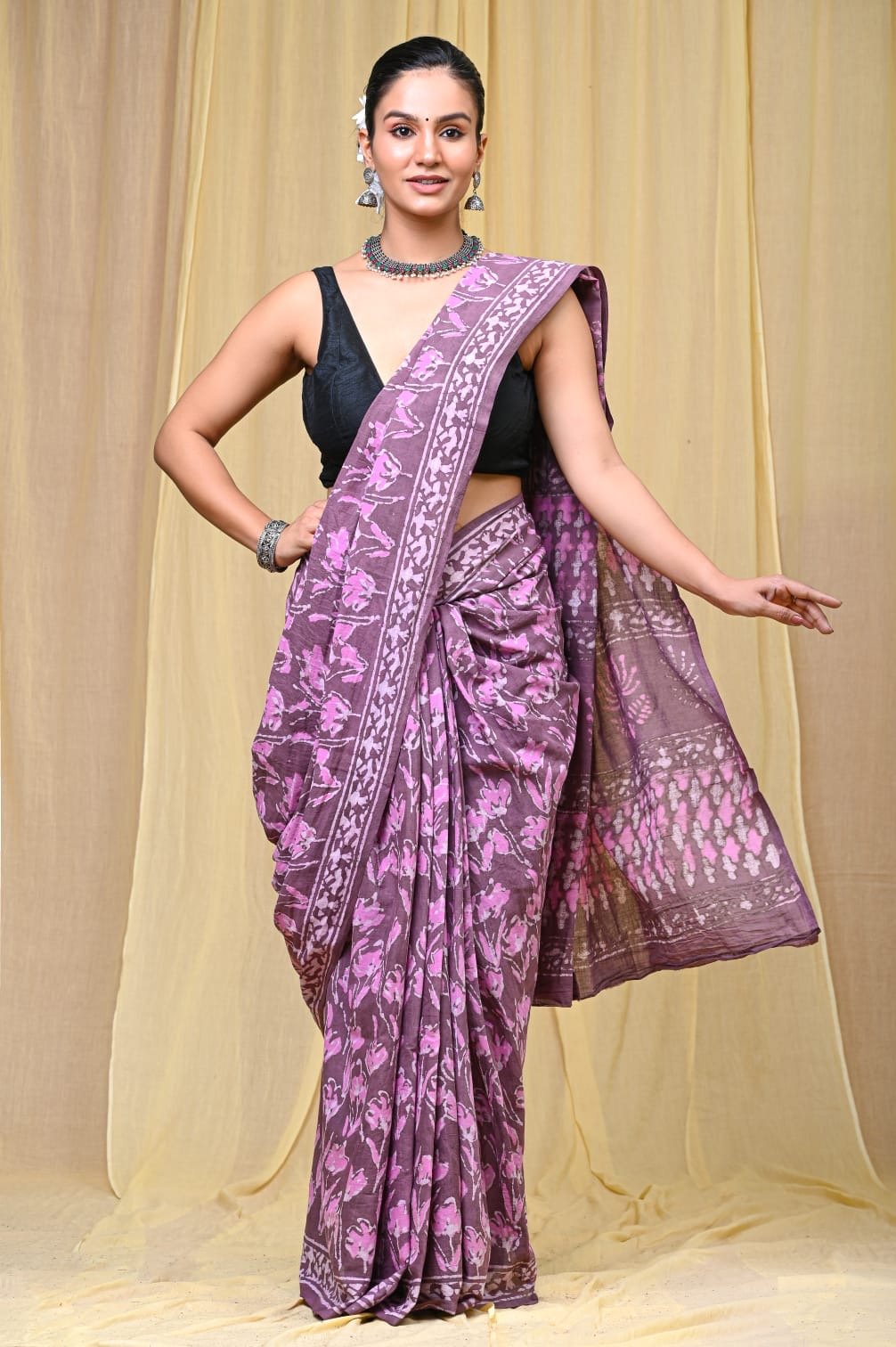 Purple saree with floral motifs and natural dyes in Bagru style