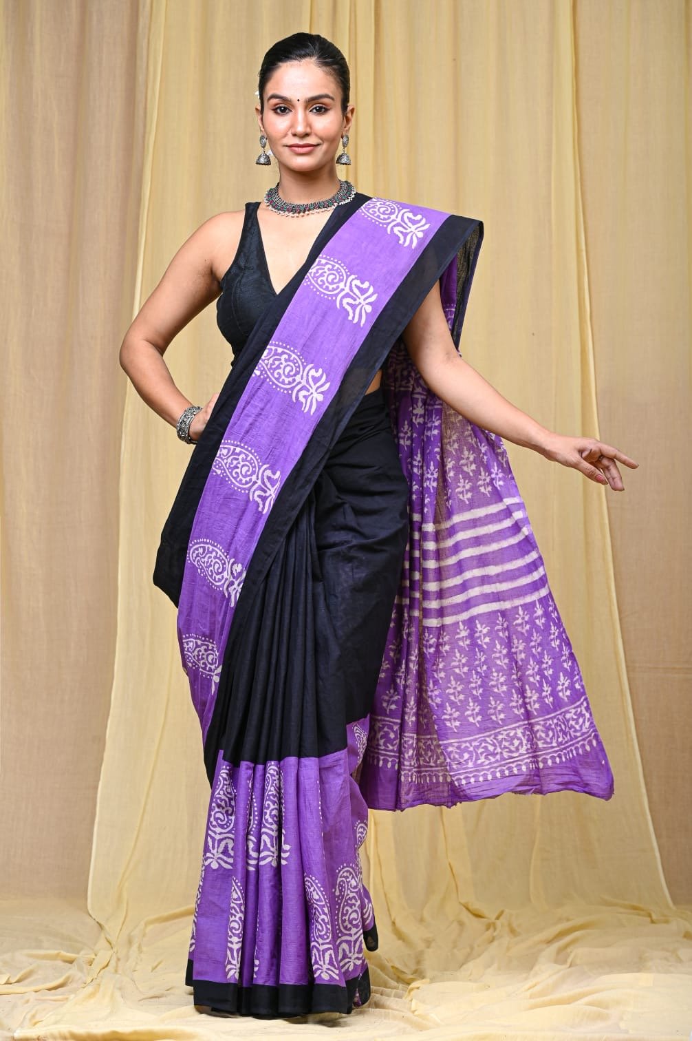 Purple saree with floral motifs and striped patterns in Bagru hand block print