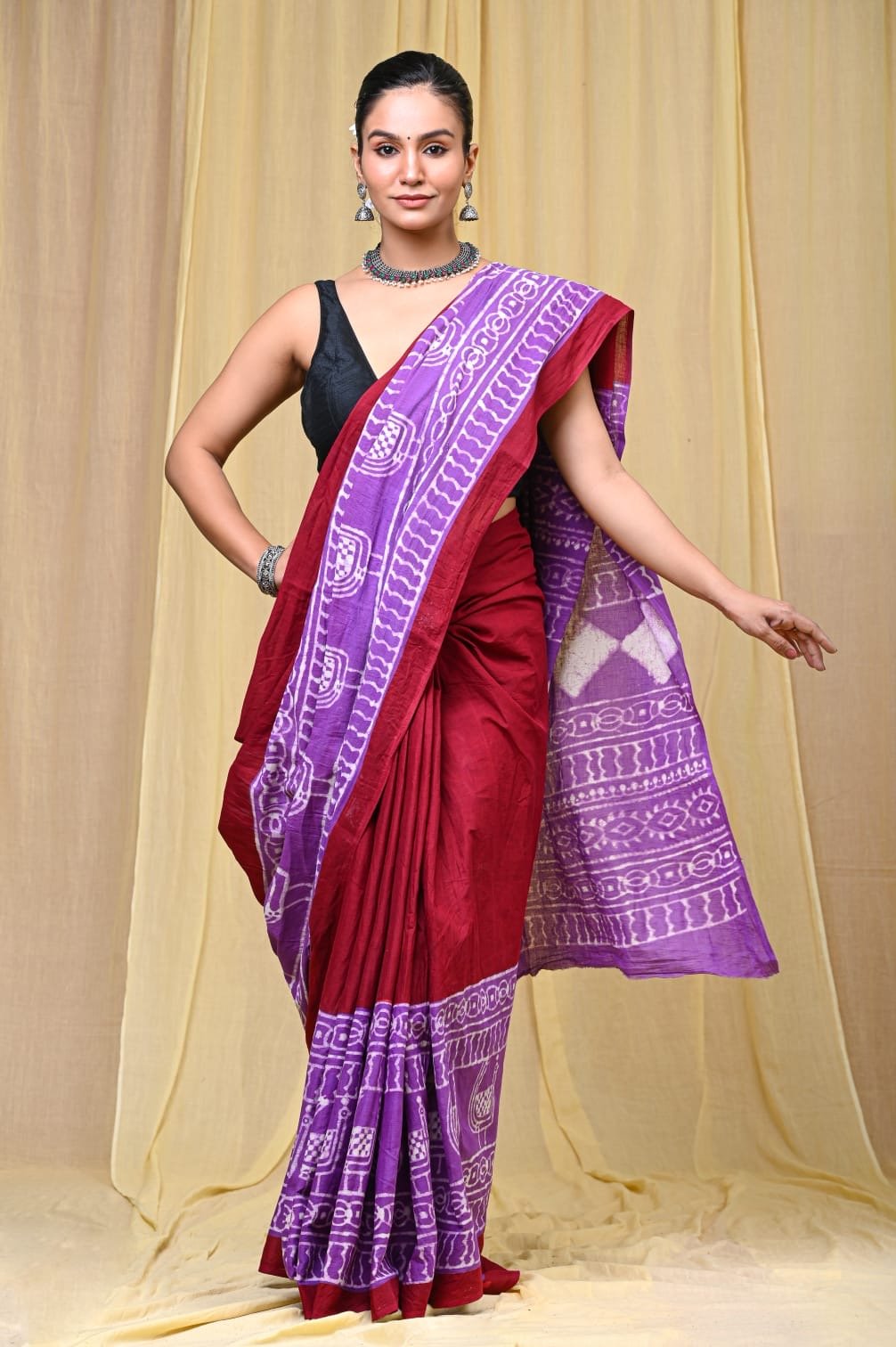 Red and purple saree with geometric and border designs in Bagru hand block print