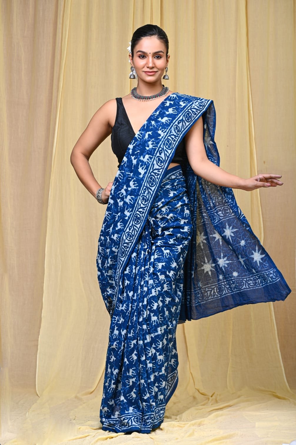 Blue saree with floral and animal motifs, hand block printed