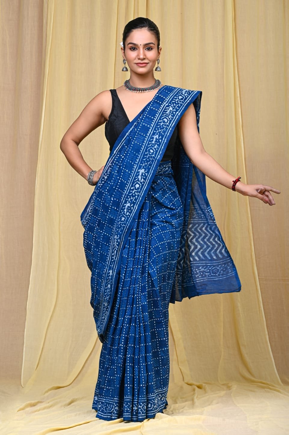 Indigo saree with white geometric motifs and detailed border design