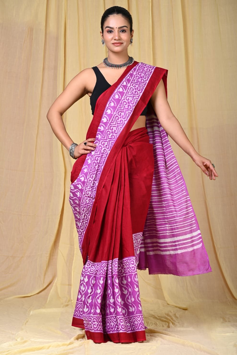 Red and purple saree with floral and striped Bagru print design