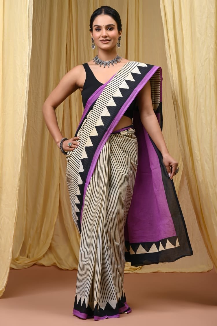 Black and white striped saree with bold geometric border in black and purple accents