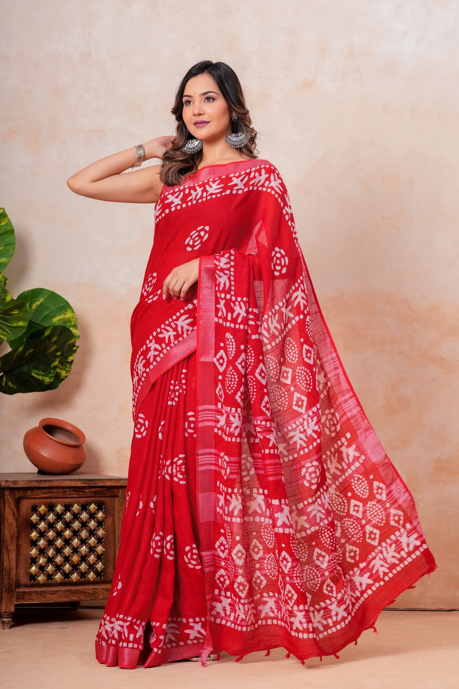 Red saree featuring geometric Bagru hand block print with white patterns