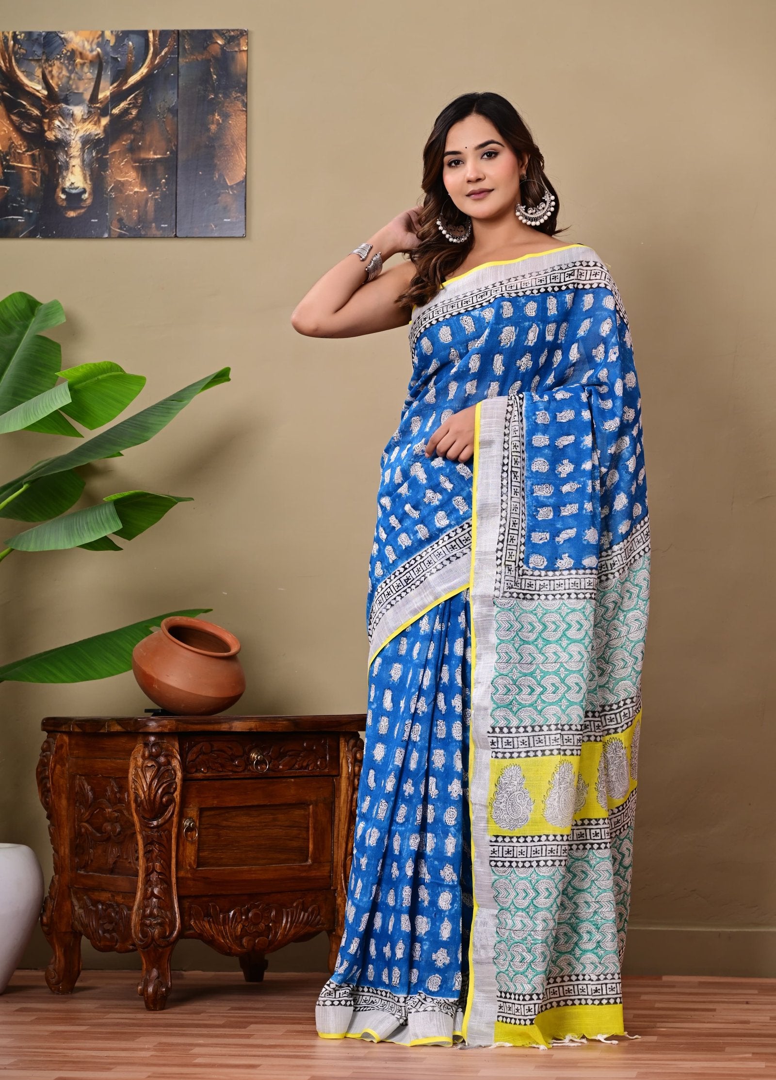 Blue saree with buta motifs and contrasting pallu