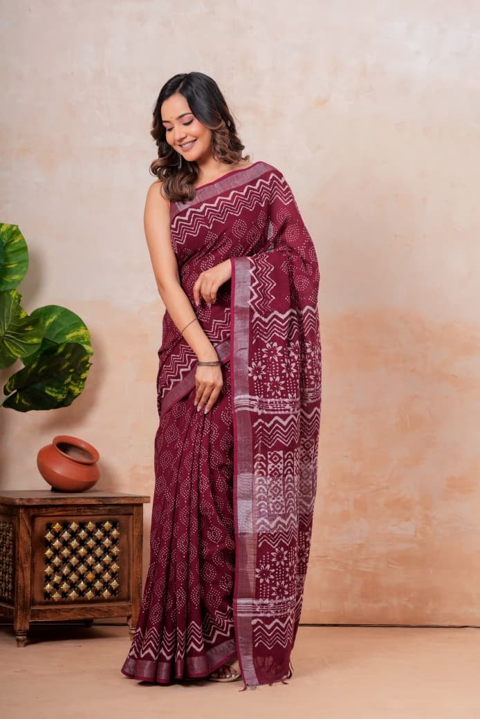 Maroon saree with white floral and geometric hand block print patterns