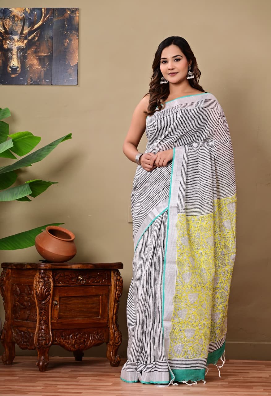 Black and white striped saree with yellow floral motifs in Bagru hand block print.