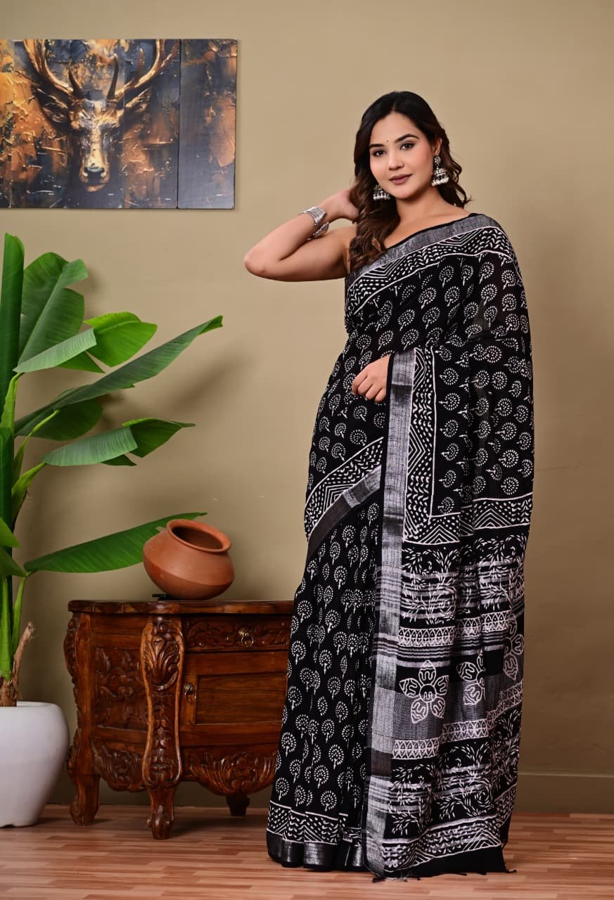 Black saree with white floral motifs and geometric hand block print