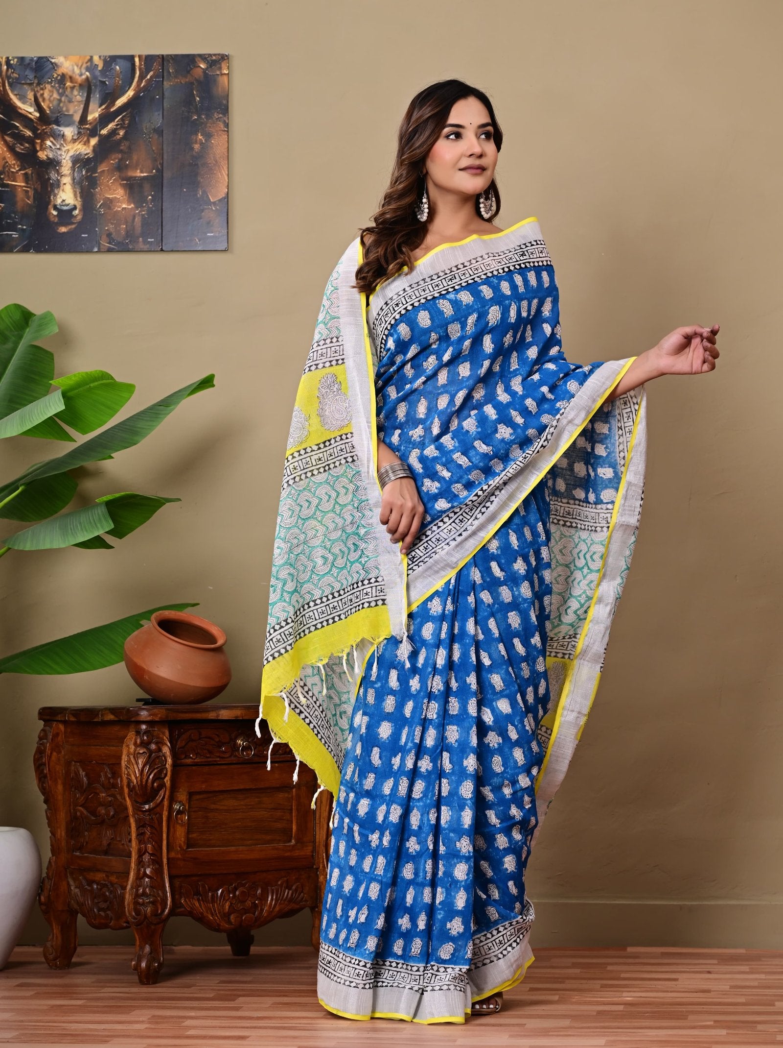 Blue linen cotton saree with white buta motifs and vibrant yellow accents