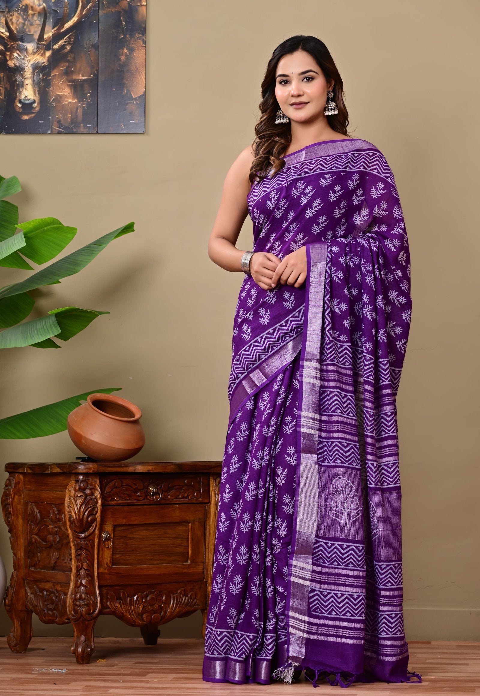 Purple saree featuring Bagru hand block floral motifs and geometric border