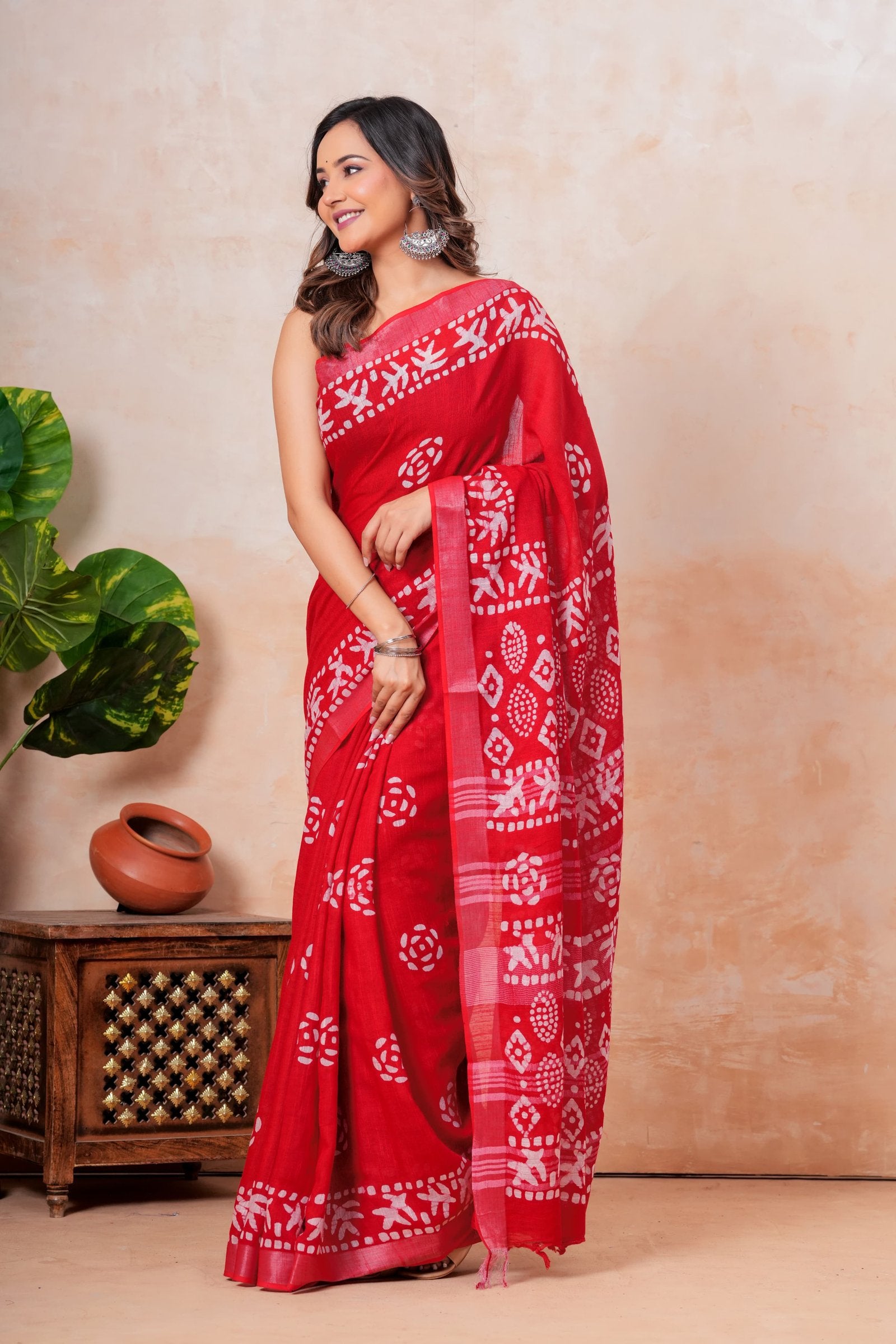 Red saree with white floral and geometric Bagru block print pattern