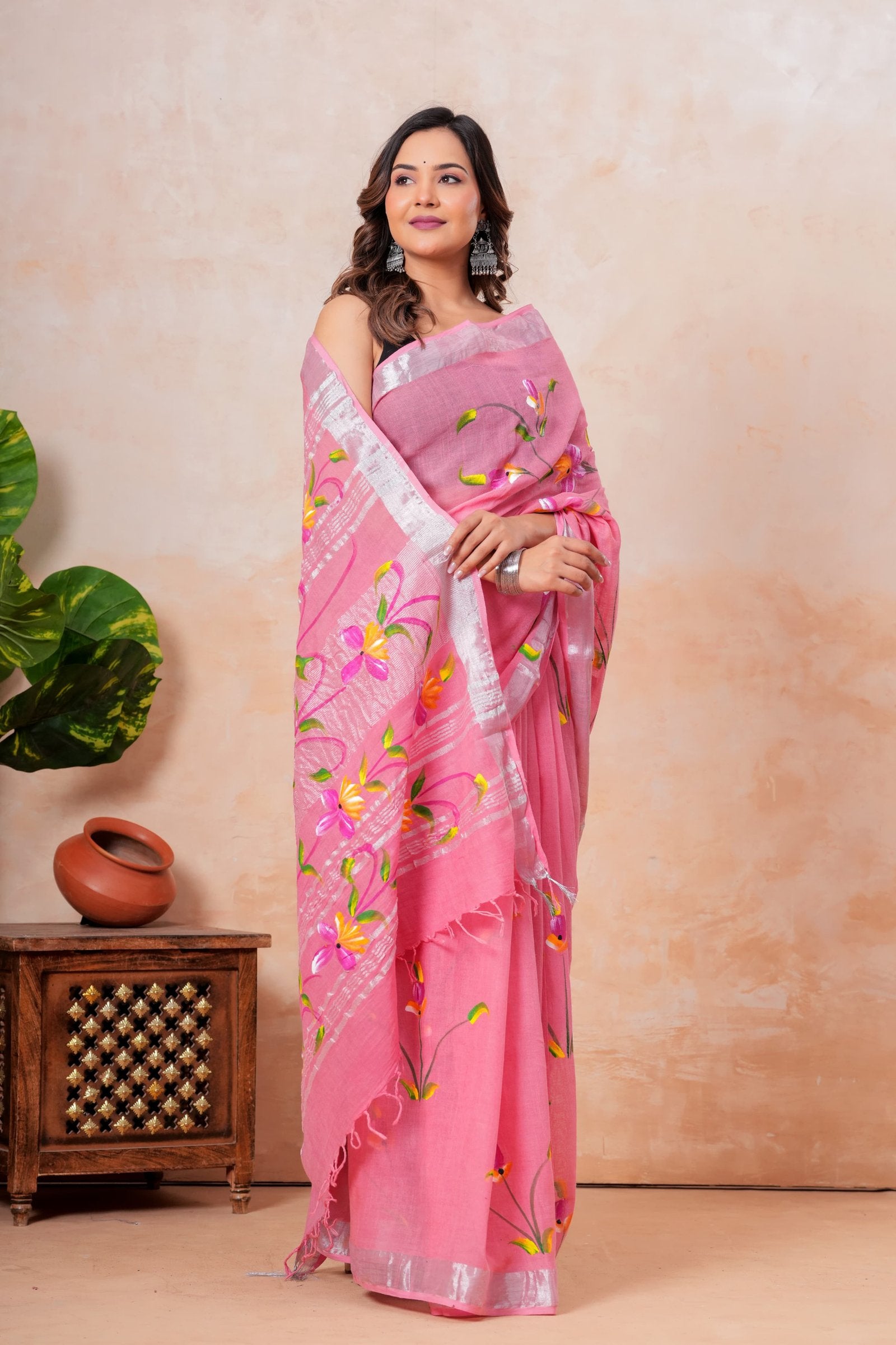 Pink saree with floral motifs in Bagru hand block print on linen-cotton fabric