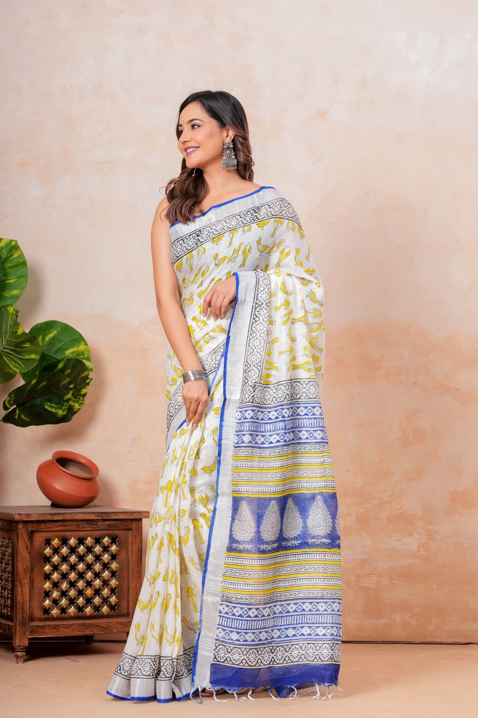 White and yellow floral hand block print saree with blue and black border