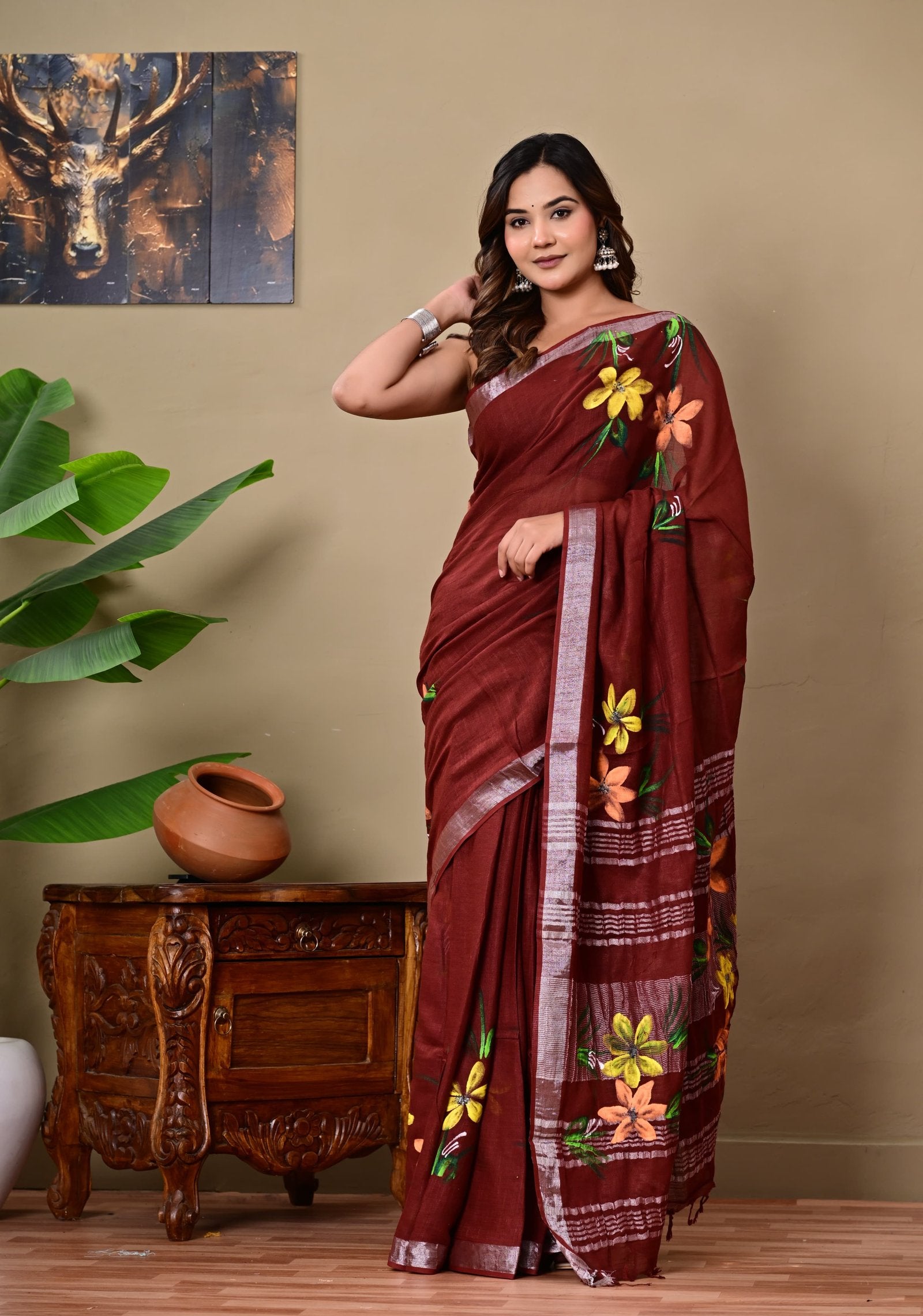 Maroon saree with vibrant floral motifs and Bagru hand block print patterns