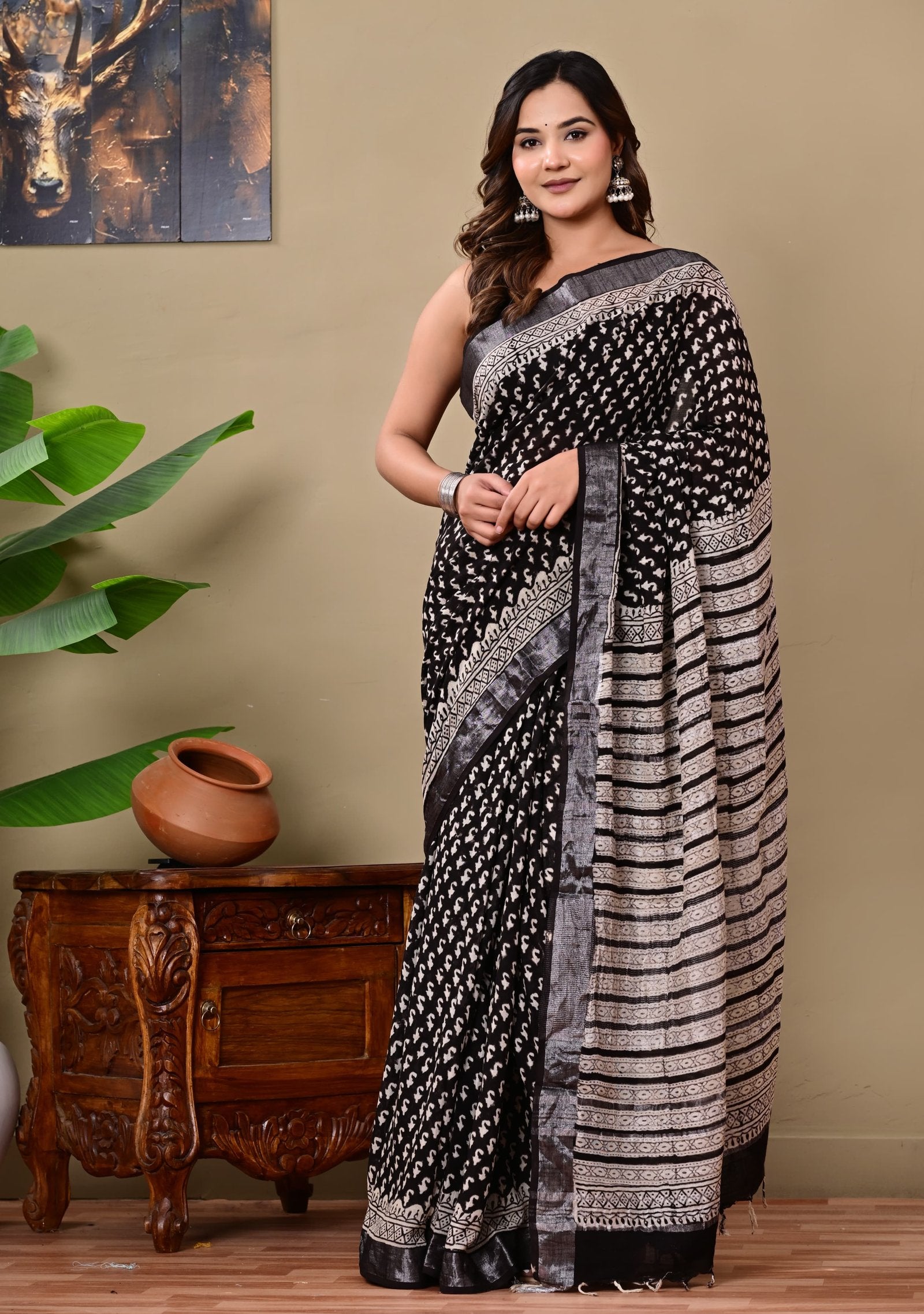Black saree with floral and geometric block print motifs