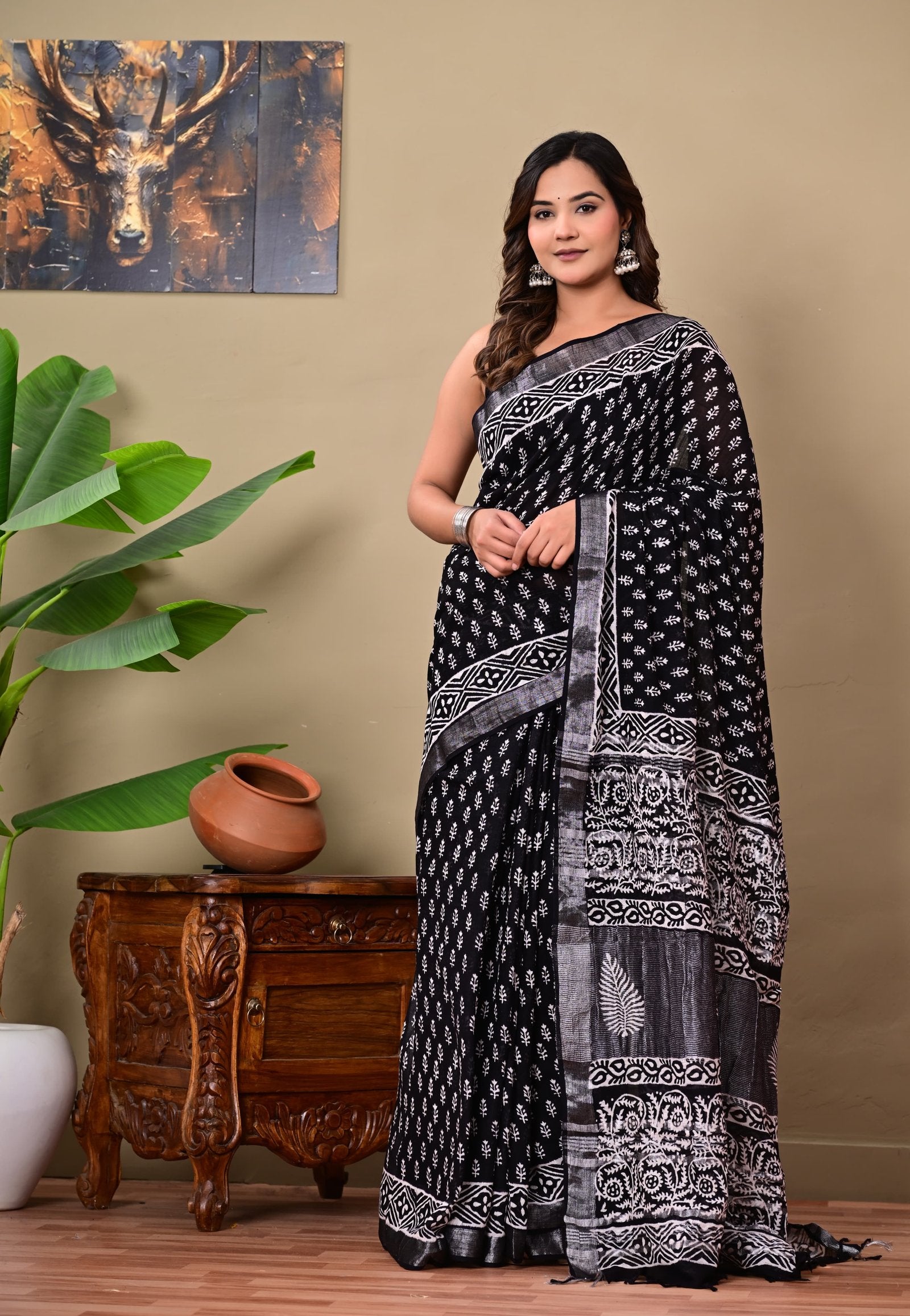 Black saree with white floral and geometric motifs, Bagru hand block print