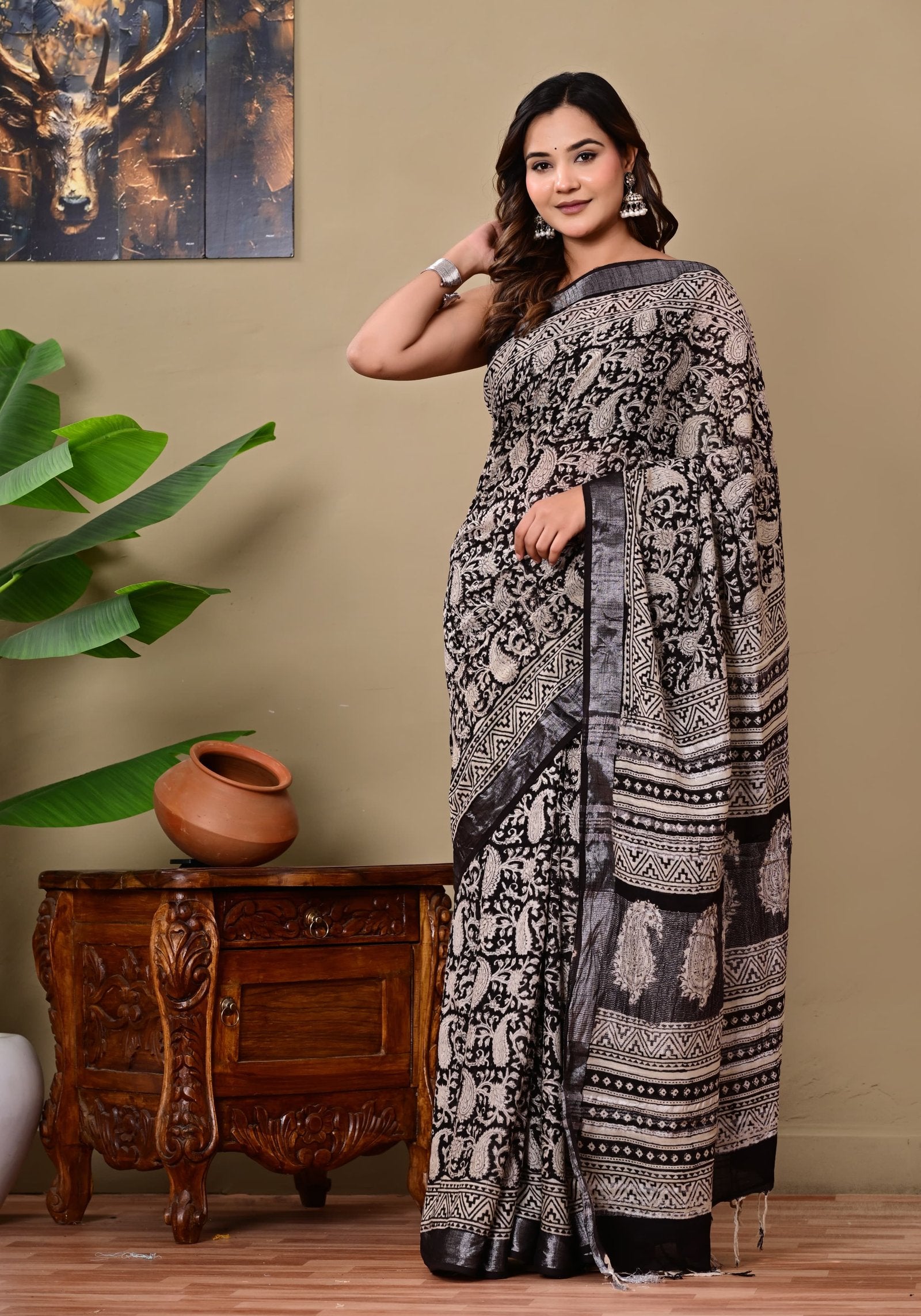 Black and white saree with intricate jaal motif in linen cotton fabric