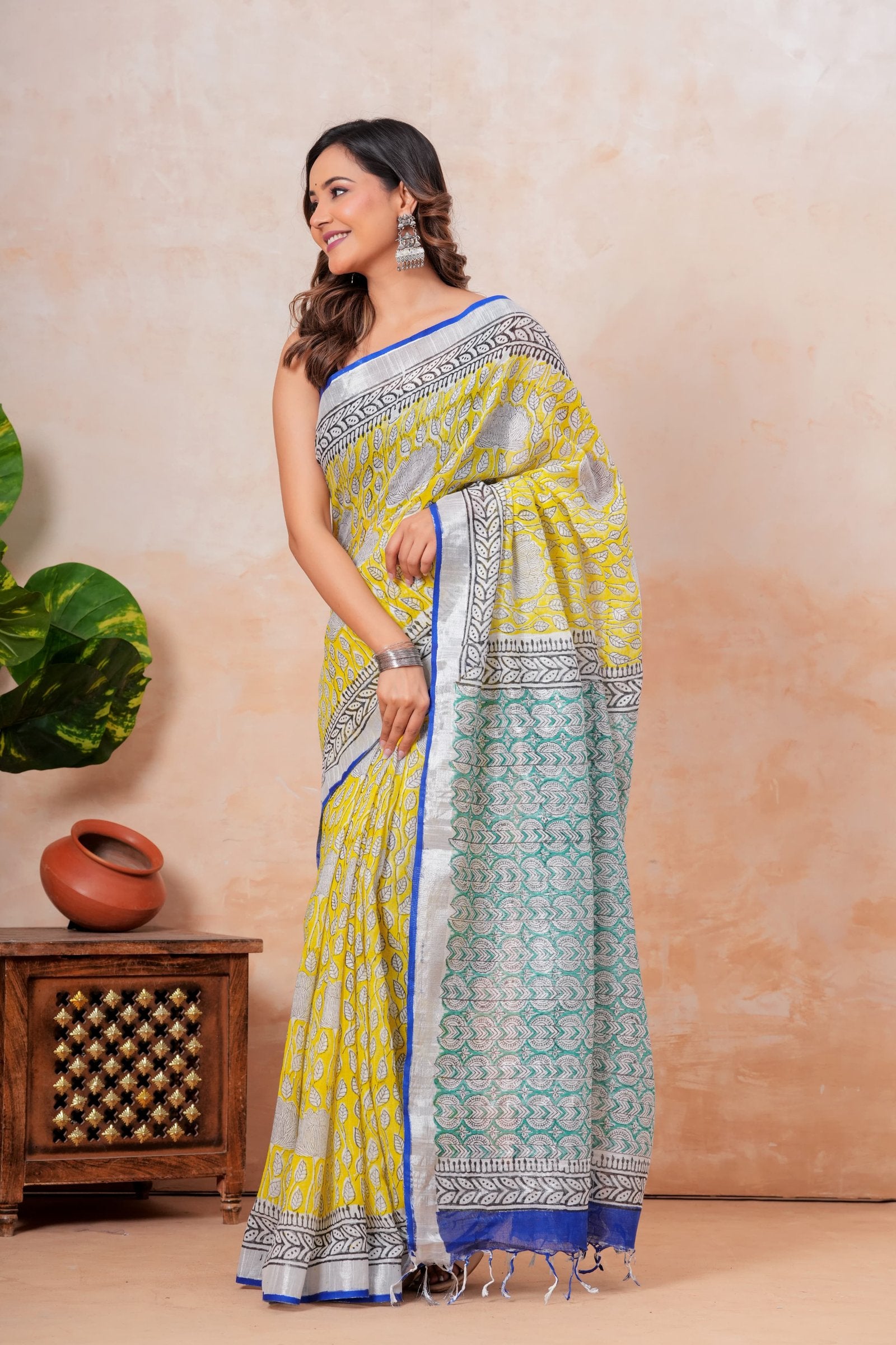 Vibrant yellow and teal floral Bagru hand block print saree with blue border