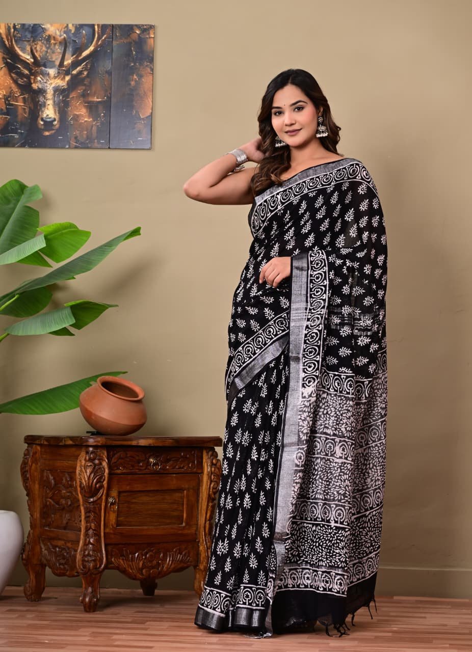 Black saree with white floral motifs, Bagru hand block print, from Bhavika Fashion.