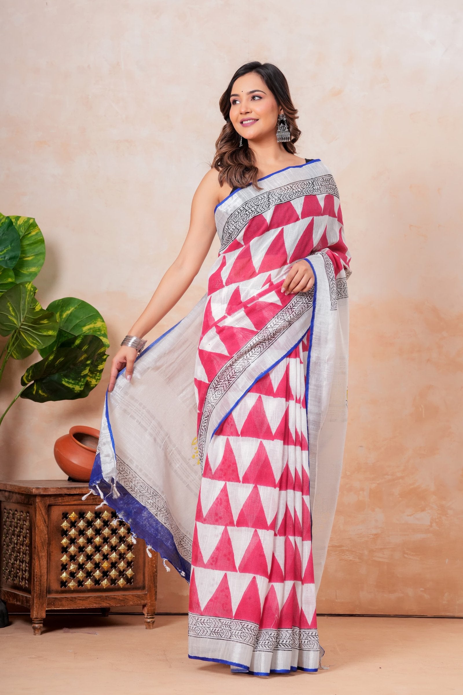 Red geometric hand block print saree in linen-cotton with traditional motifs and elegant border