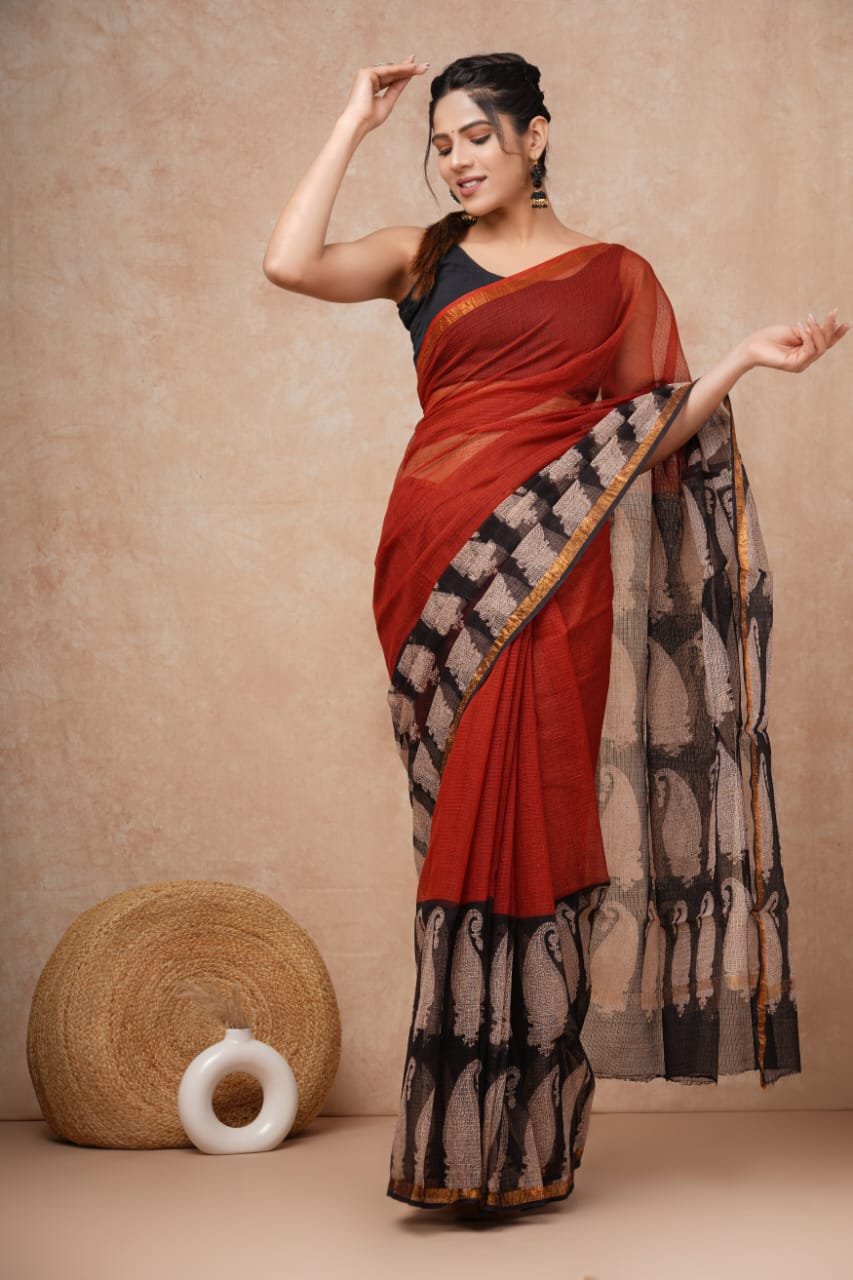 Rust Kota Doriya saree with black paisley motifs and intricate hand block print