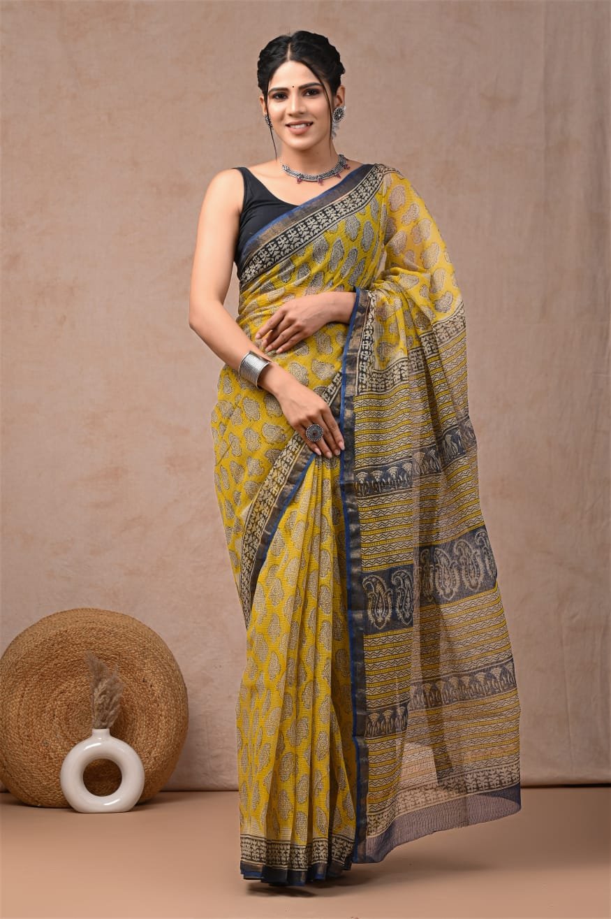 Yellow Kota Doriya saree with floral Bagru block prints and navy border