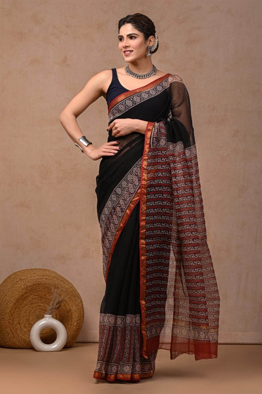 Black saree with rust and white geometric motifs in Bagru hand block print
