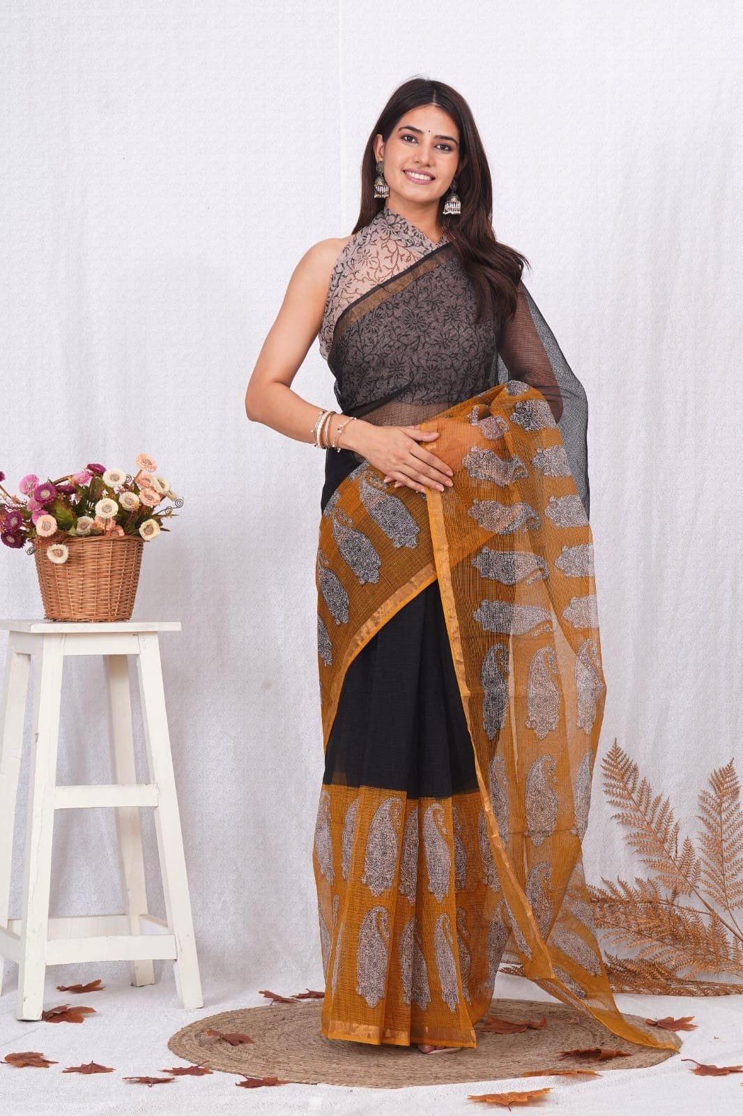 Black and mustard saree with paisley motifs in Bagru hand block print