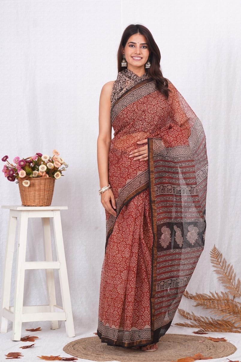Rust saree with black floral Bagru block print and elegant border