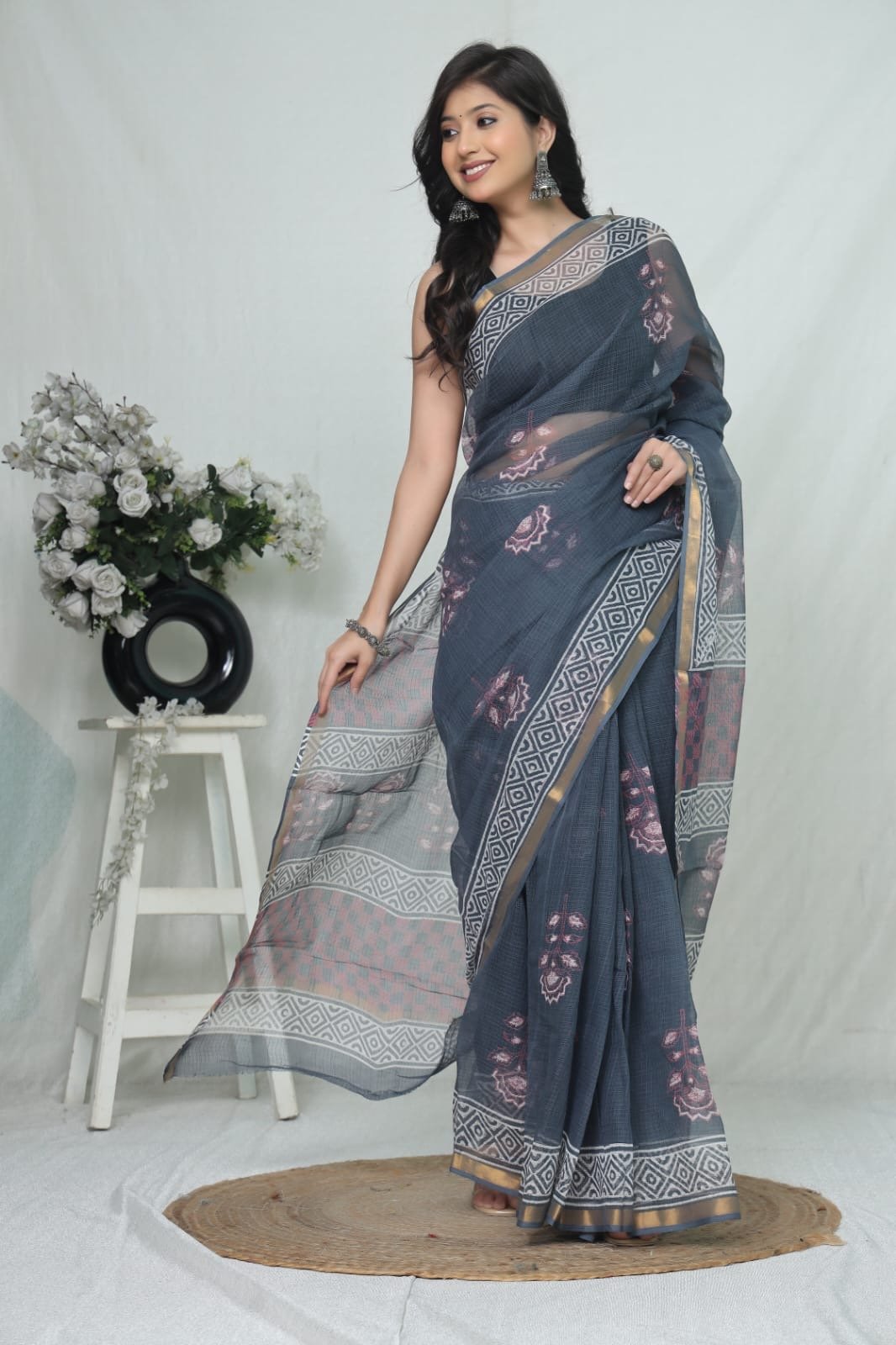 Blue saree with floral Bagru prints and geometric border