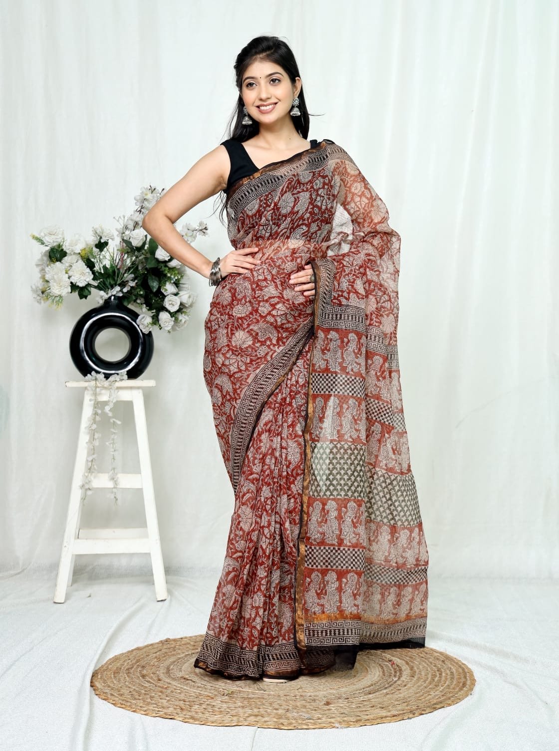 Red floral Kota Doriya silk saree with intricate motifs and border