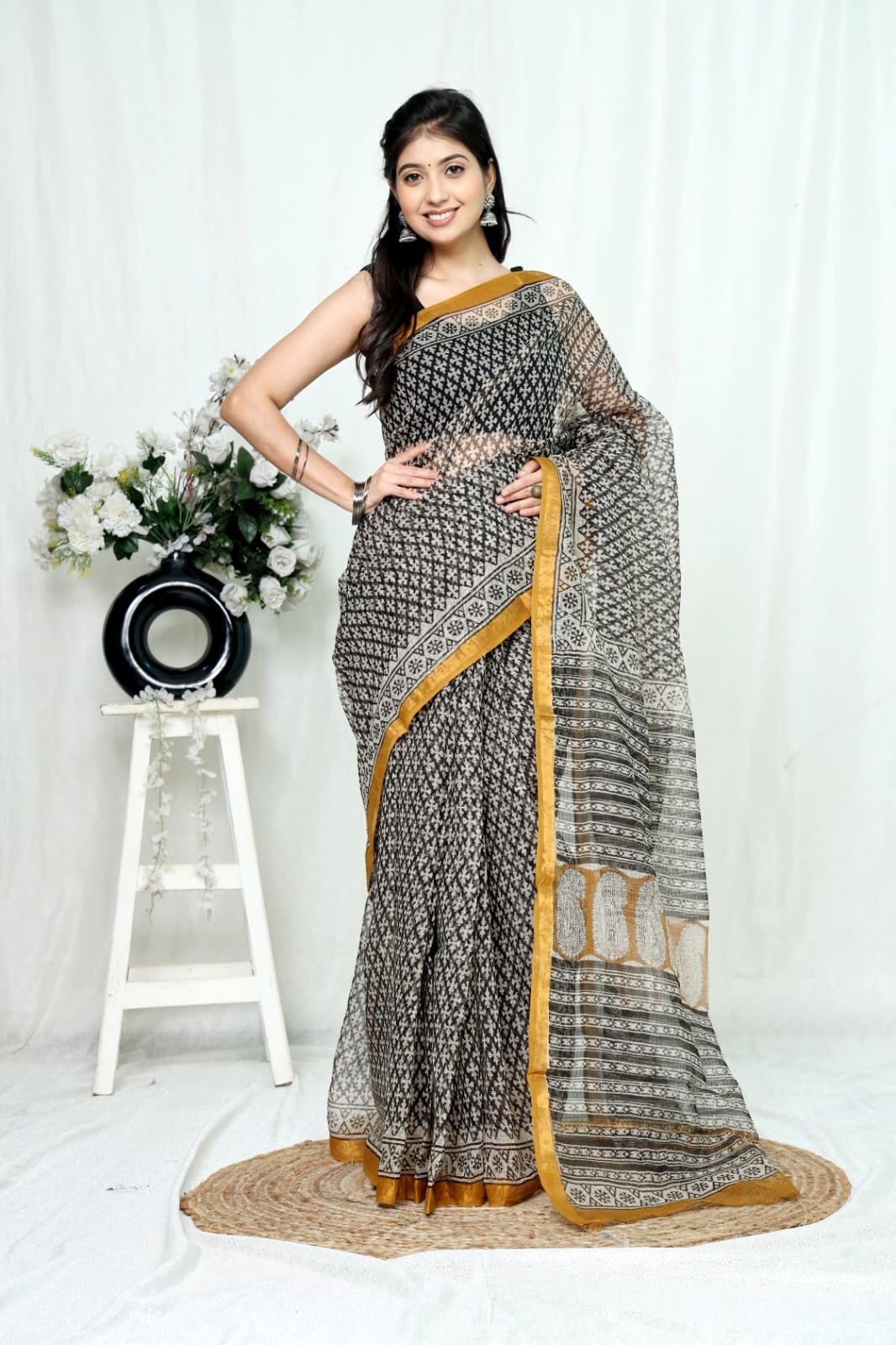Black Kota Doriya Silk saree with floral motifs and mustard border