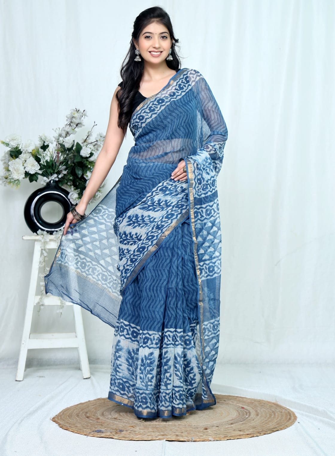 Navy blue saree with floral and geometric motifs in Bagru hand block print