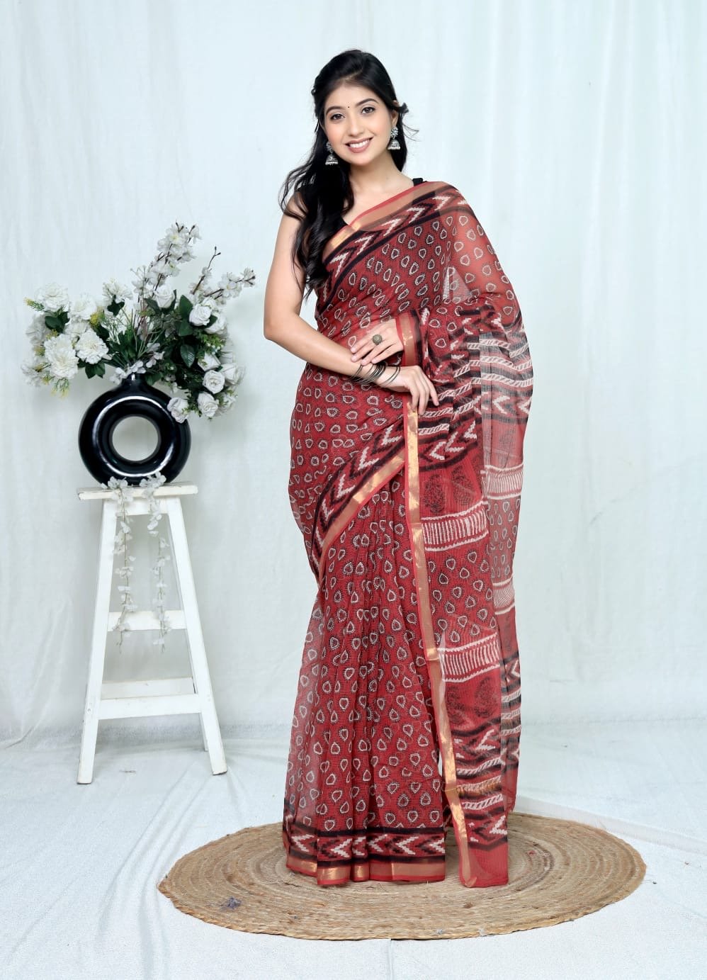 Maroon Kota Doriya saree with buta motifs and geometric border