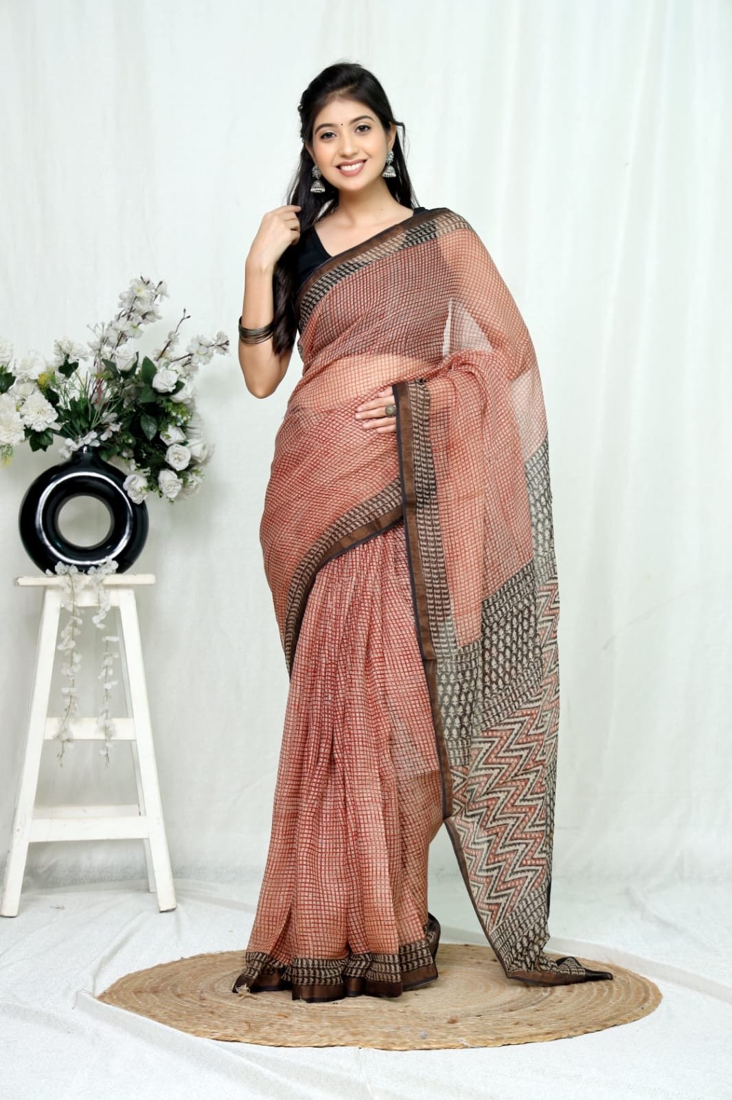 Rust and black Kota Doriya saree with geometric Bagru hand block print motifs