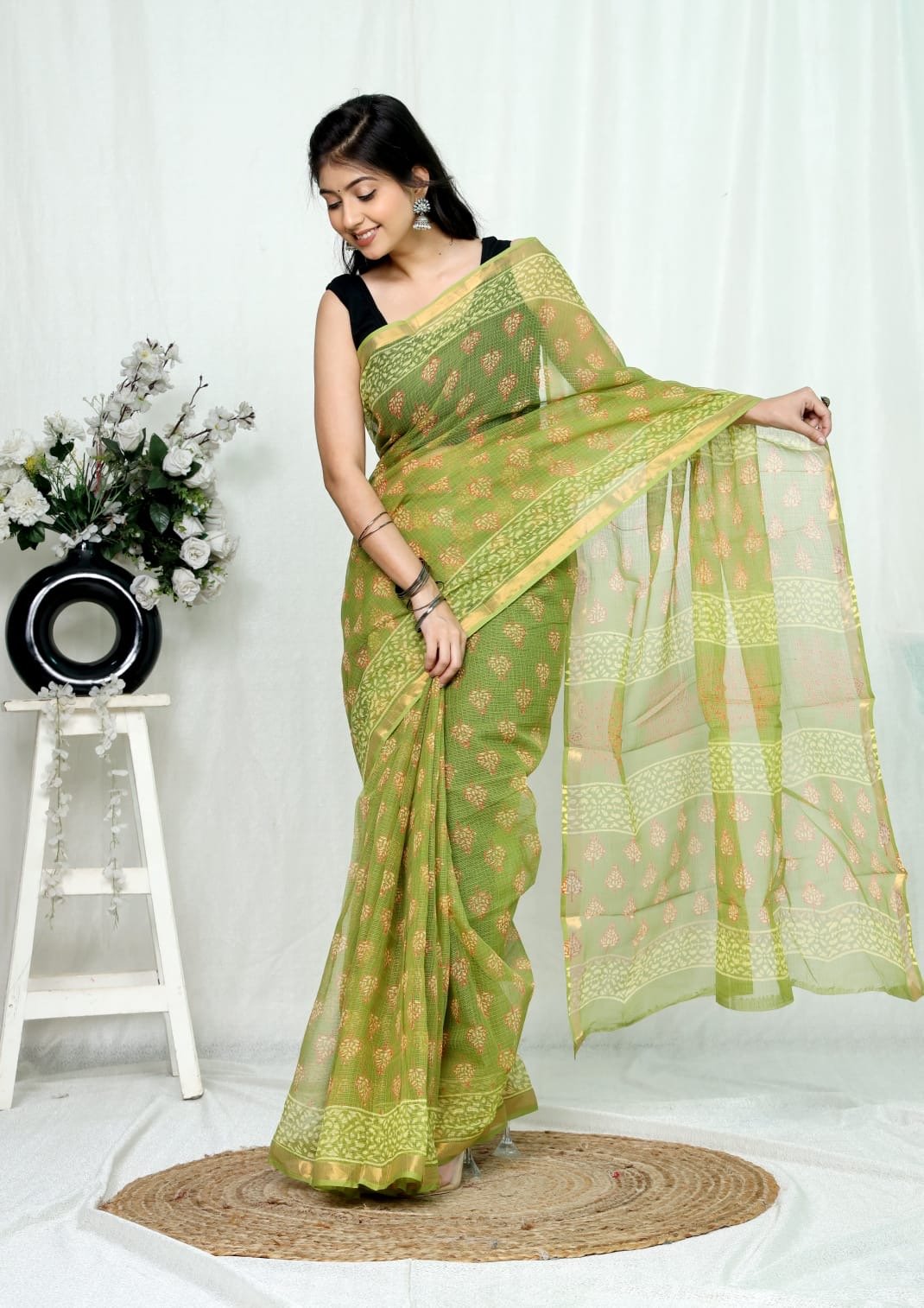 Green saree with floral buta motifs and Bagru hand block print