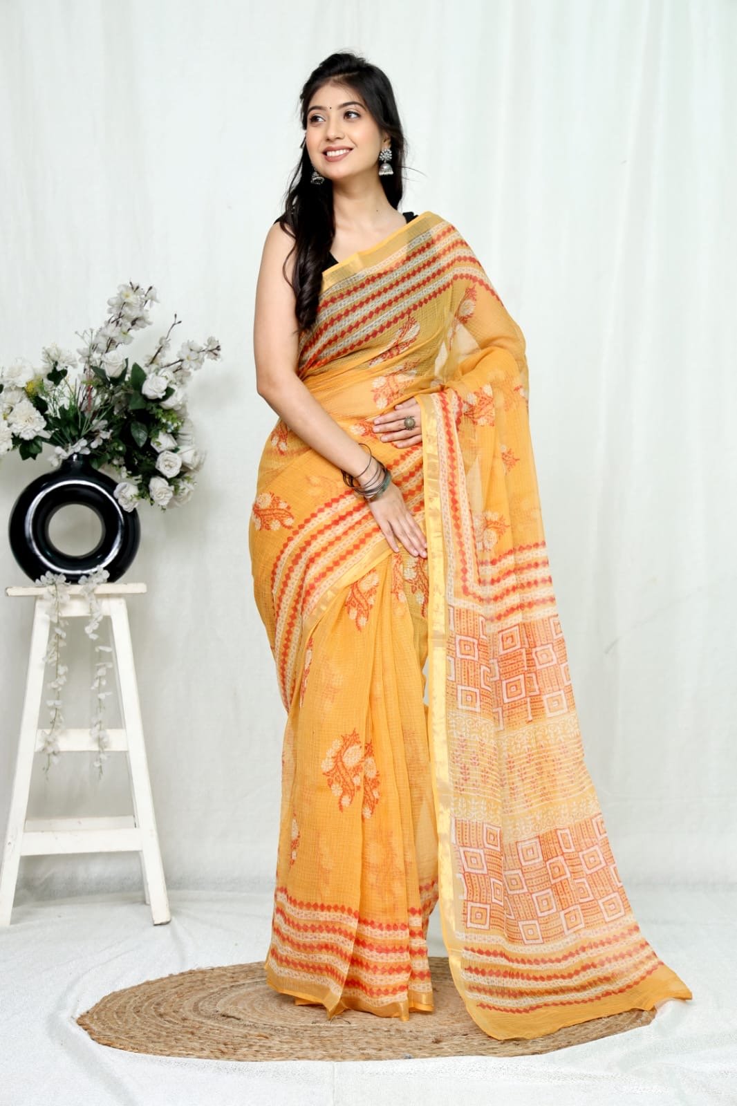 Yellow saree with floral and geometric Bagru patterns and khat texture