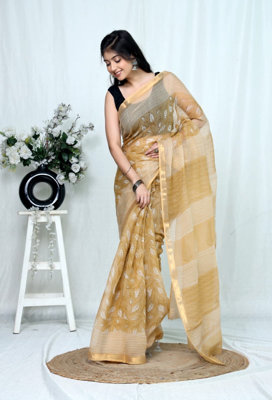 Golden saree with floral motifs and khat texture, Bagru block print