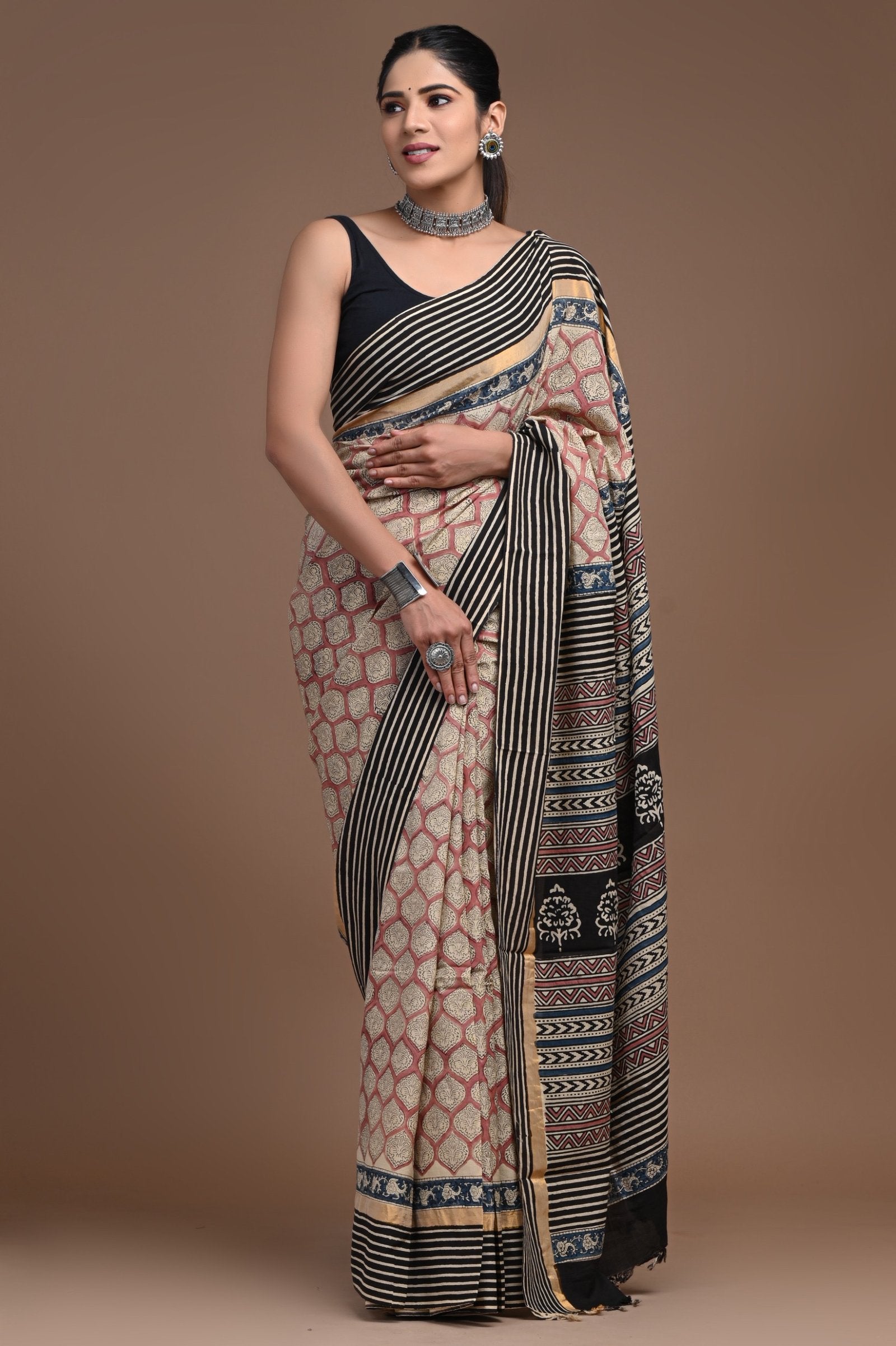 Black and beige saree with geometric motifs and bold stripe borders