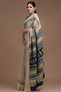 Blue and beige saree with floral and geometric motifs in Assam silk