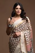 Beige and red saree with floral and geometric motifs