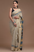 Saree with indigo floral and geometric motifs on beige background