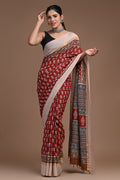 Maroon saree with floral buta motifs and detailed border