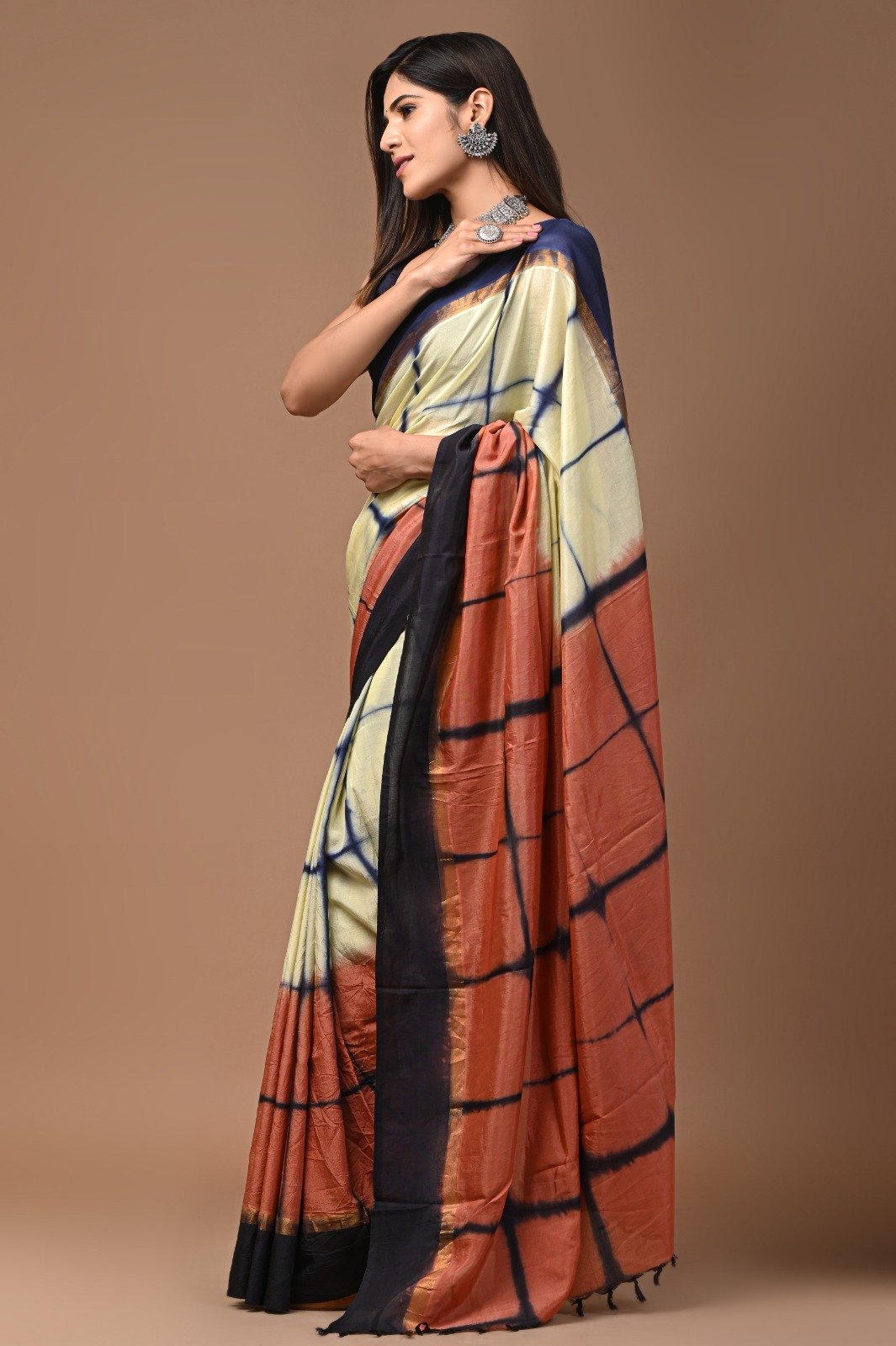Cream and rust saree with geometric block print motif and soft sheen