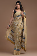 Gold and indigo saree with intricate floral hand block print and striped border.