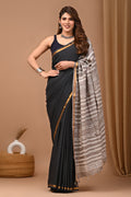 Black saree with gold border and grey striped block print design