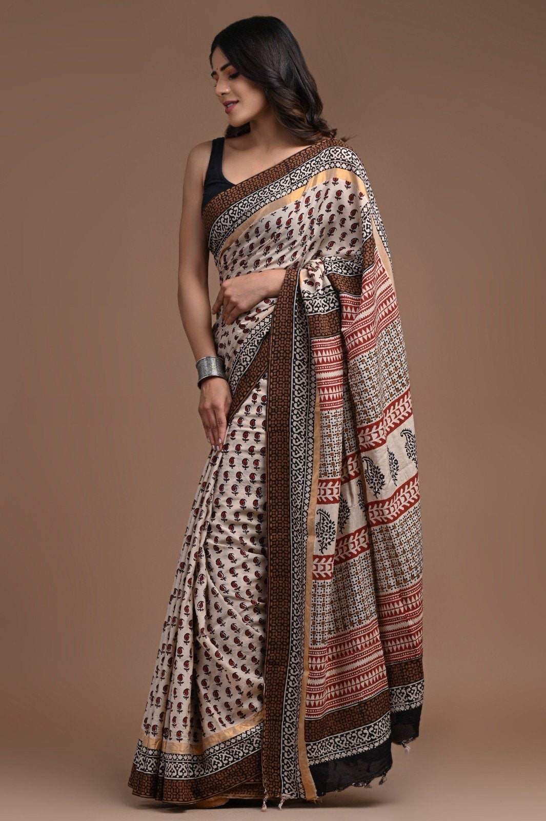 Ivory and maroon saree with floral jaal and geometric patterns, handcrafted detailing